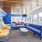 a room with blue couches and a table