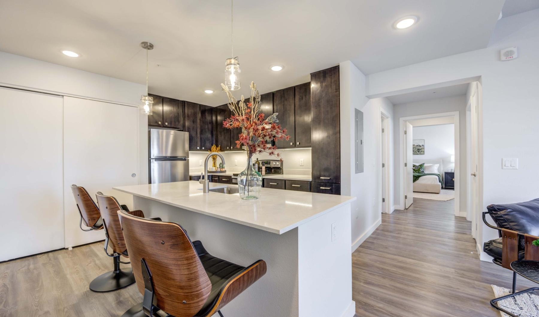 a kitchen with a dining table and chairs