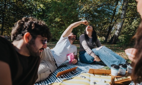 Friends gathering and relaxing outdoorS