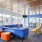 a room with blue couches and a table