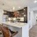 a kitchen with a dining table and chairs