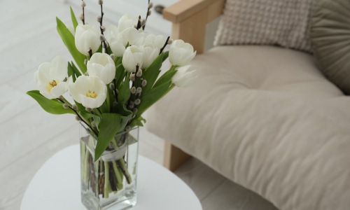 Bouquet of white flowers on a small coffee table 